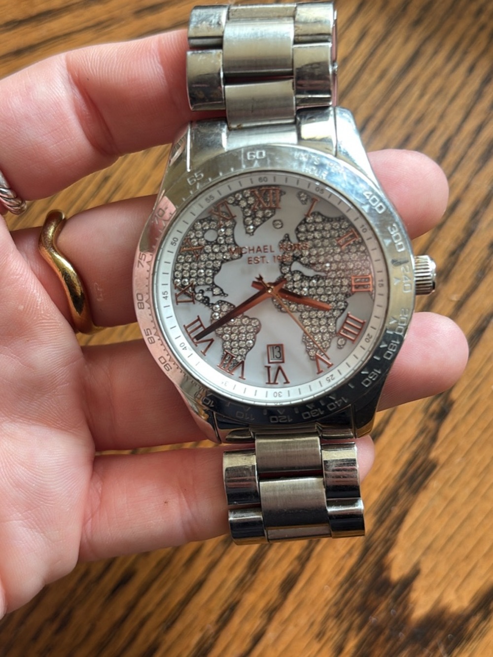 Michael Kors Silver and Rose Gold Crystal World Map Bracelet Watch